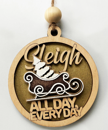 Elegant round wooden ornament with a sleigh design and the text "Sleigh All Day Every Day" for festive holiday decoration.